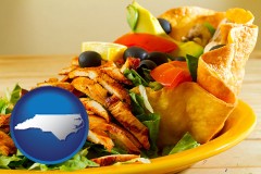 north-carolina map icon and a Mexican restaurant salad